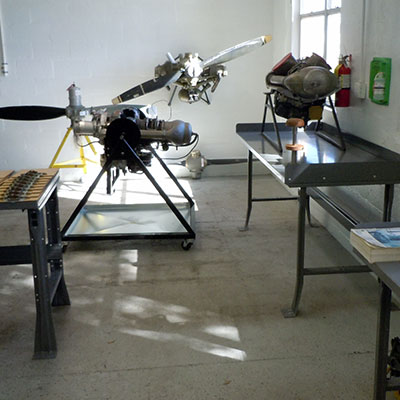 A room with a table and some metal equipment