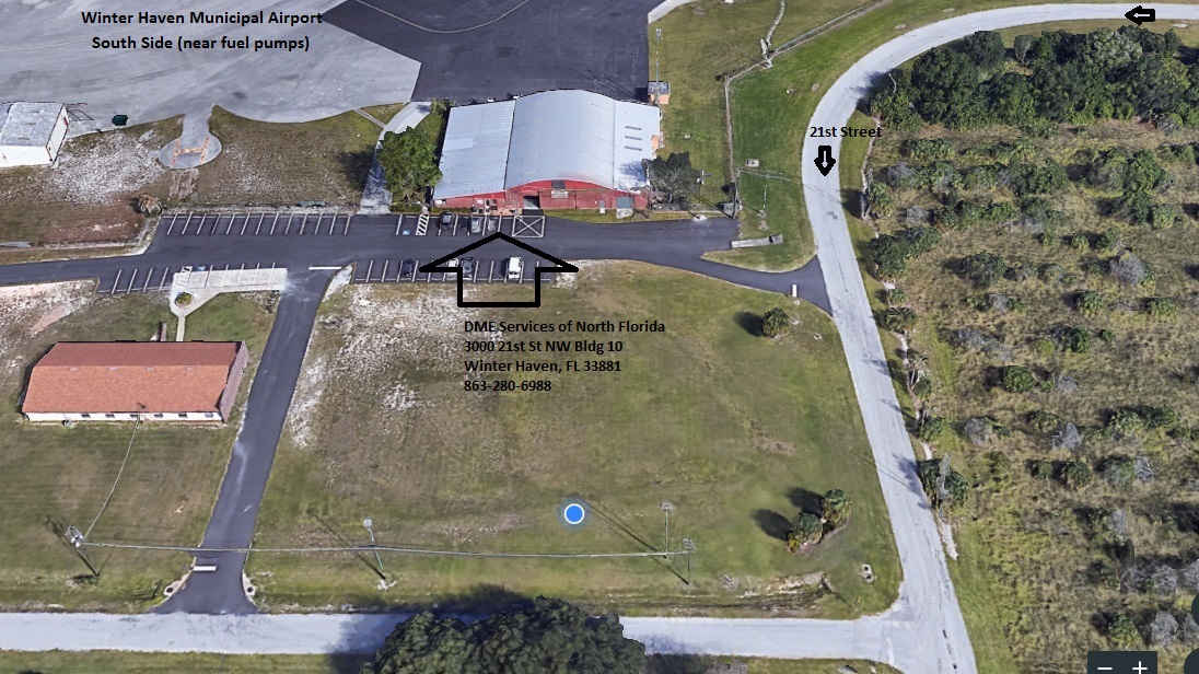 A bird 's eye view of a building and parking lot.