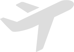 A white airplane is shown on the ground.